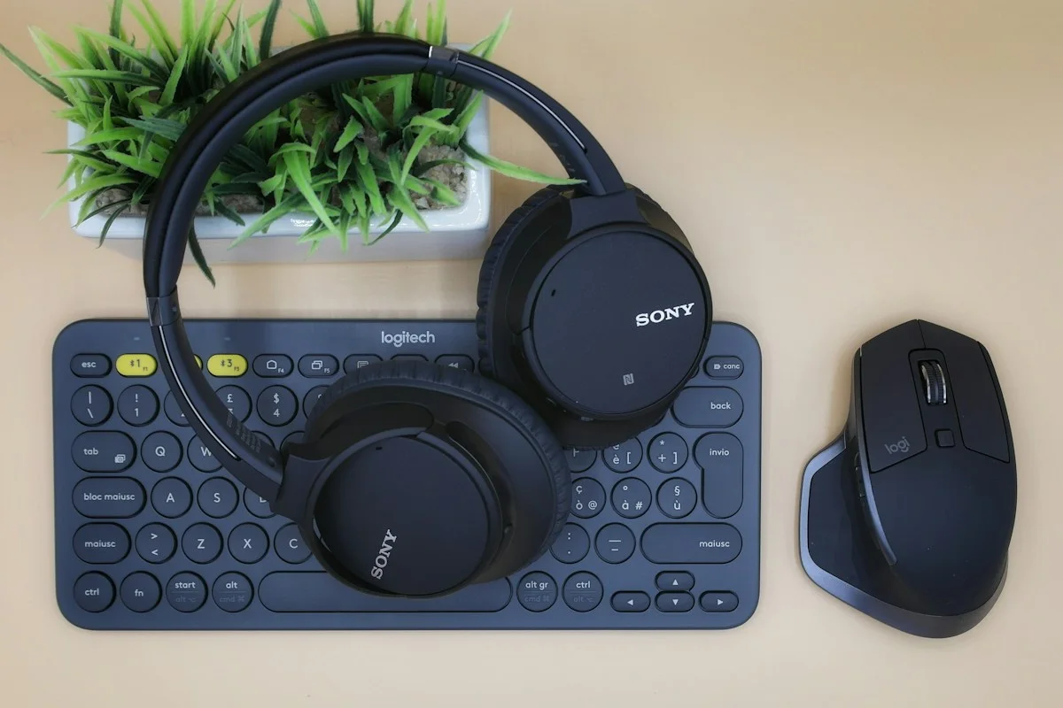 Headphones keyboard and mouse on a desk
